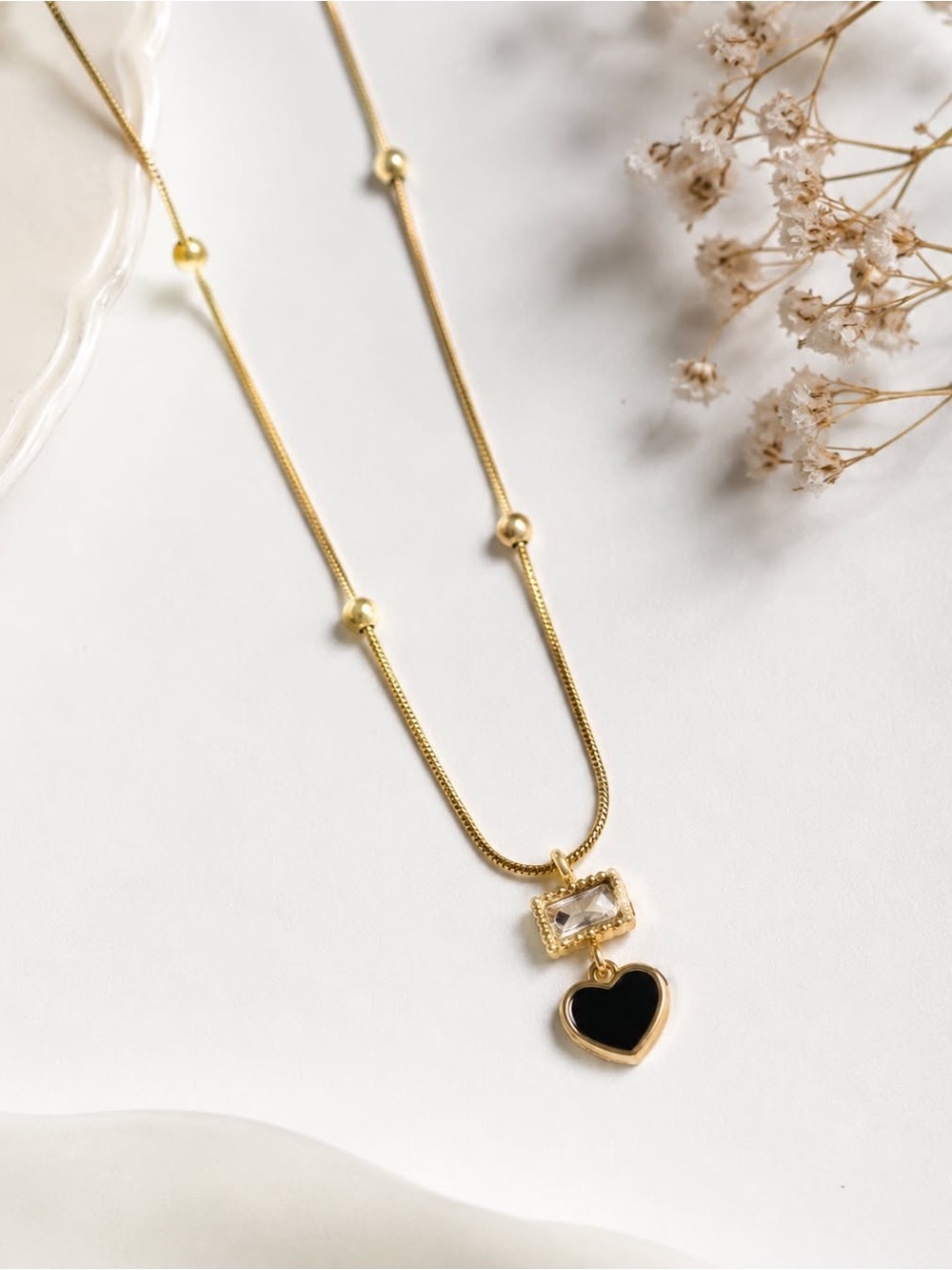 Gold Necklace with Black Heart Pendant